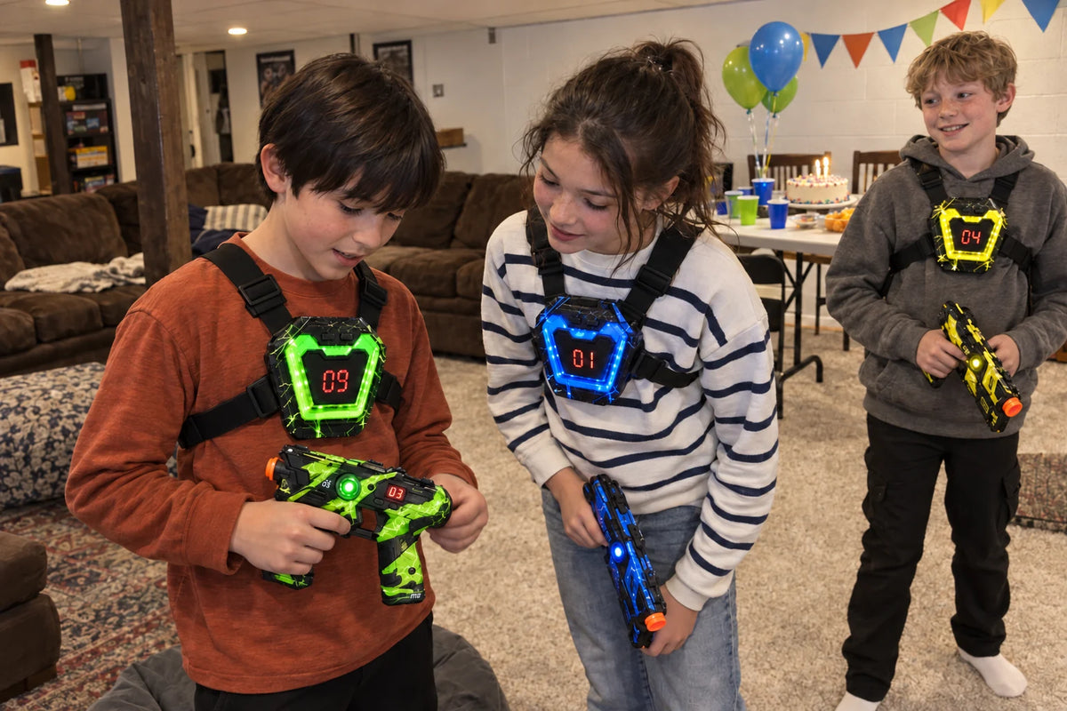 Three friends comparing their laser tag equipment at a basement birthday party